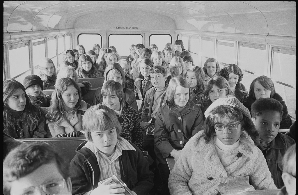 [African American and white school children on a school bus, riding from the suburbs to an inner city school, Charlotte, North Carolina]