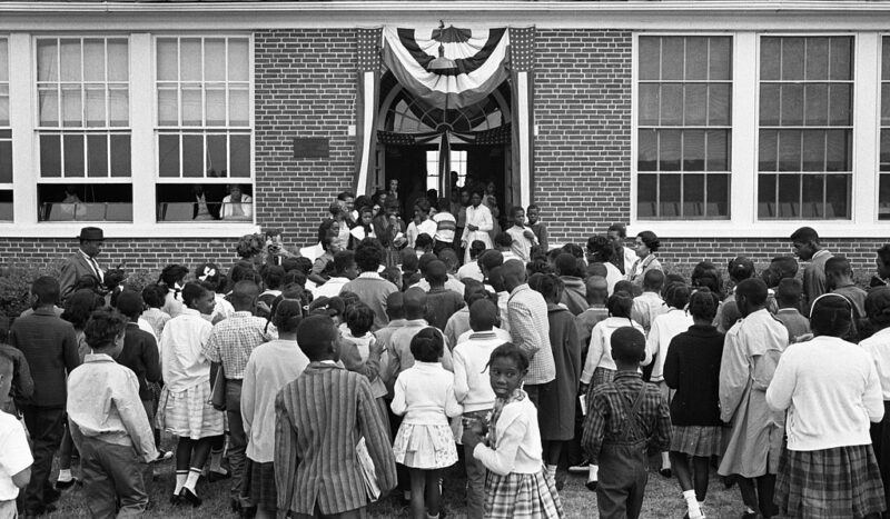 [African American school children entering the Mary E. Branch School at S. Main Street and Griffin Boulevard, Farmville, Prince Edward County, Virginia]